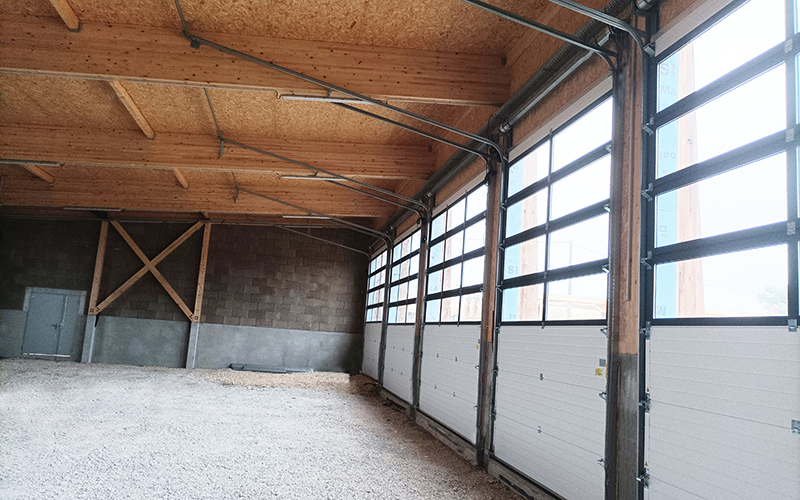 Porte sectionnelle industrielle ARIANE sans ressorts - Batiweb