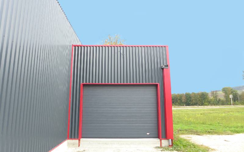 Porte sectionnelle industrielle ARIANE NANO sans ressorts - Batiweb